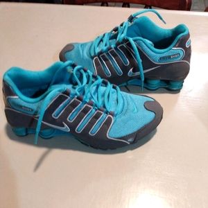 Blue and gray Nike Shox